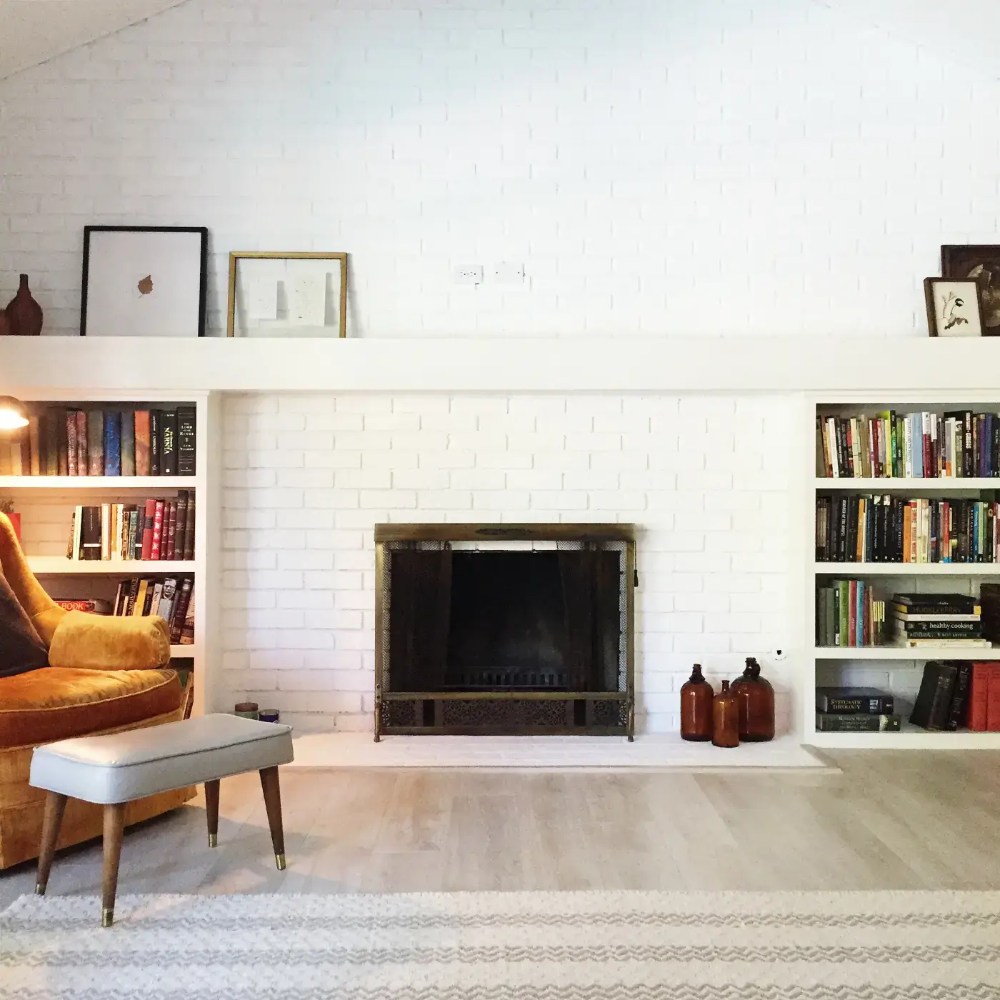 Cozy interior with bookshelves and fireplace